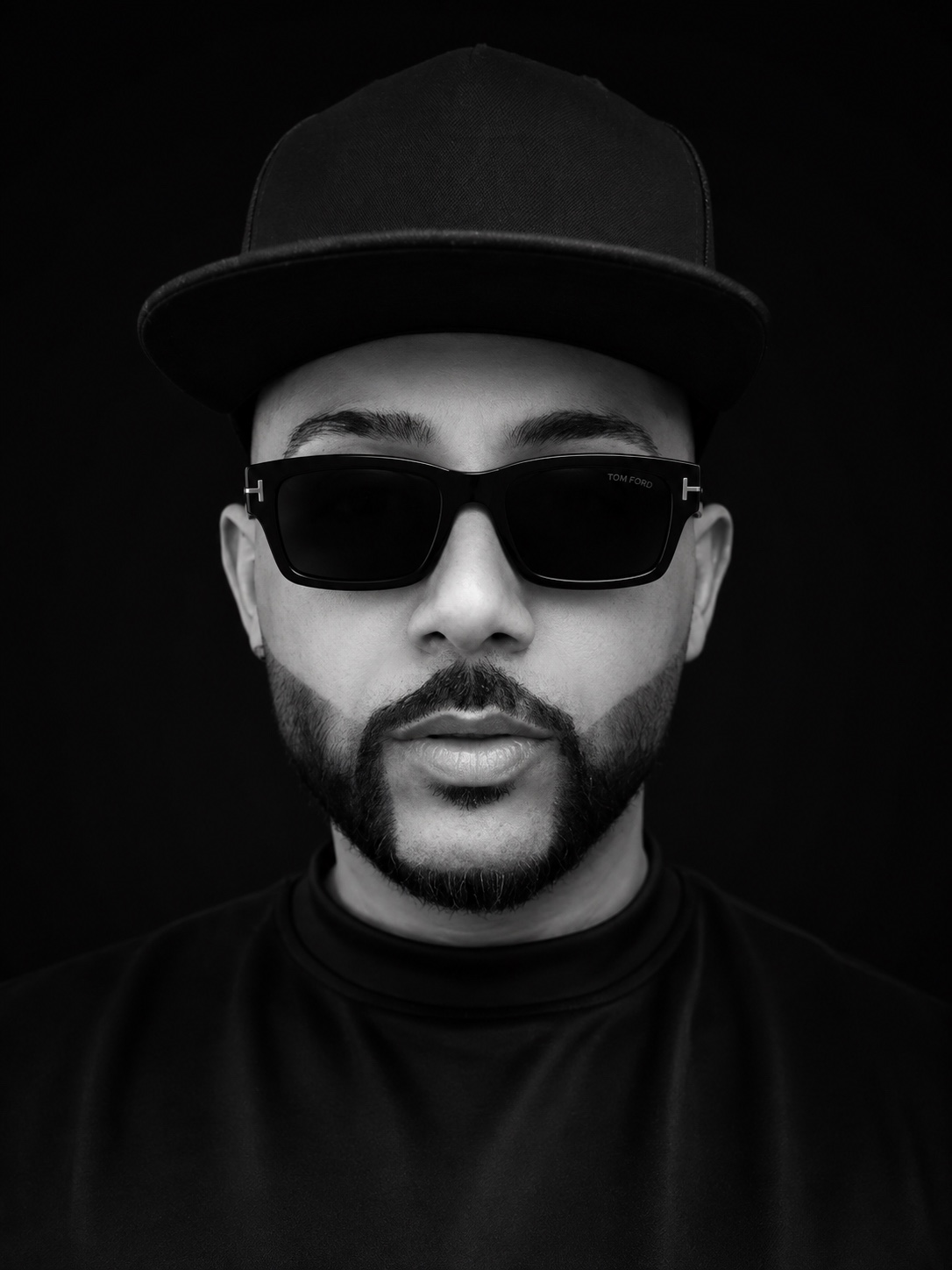 DJ PRADZ in a black cap and sunglasses